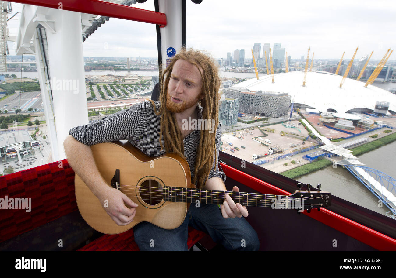 Newton Faulkner performs an exclusive gig for competition winners in one of the Olympic Emirates Air Cable Cars, which cross the river Thames in east London. PRESS ASSOCIATION Photo. Picture date: Tuesday July 17, 2012. Photo credit should read: PA/PA Wire Stock Photo
