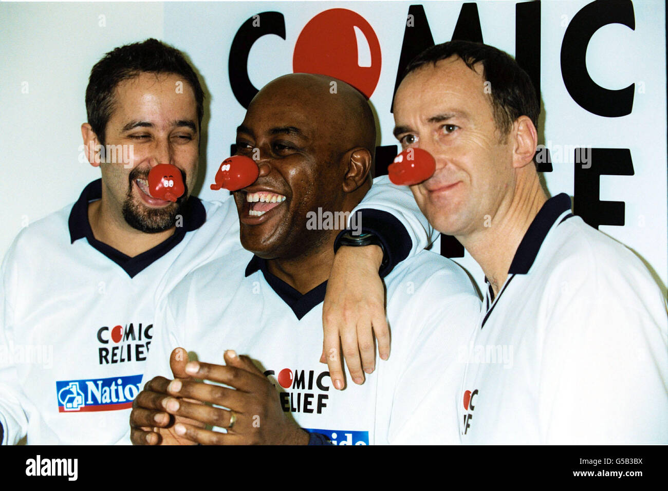 David Baddiel, Ainsley Harriott and Angus Deayton team up for the Sporting Nose celebraties football team. The TV stars were lining up at Olympia in London, during a Comic Relief football day. Stock Photo