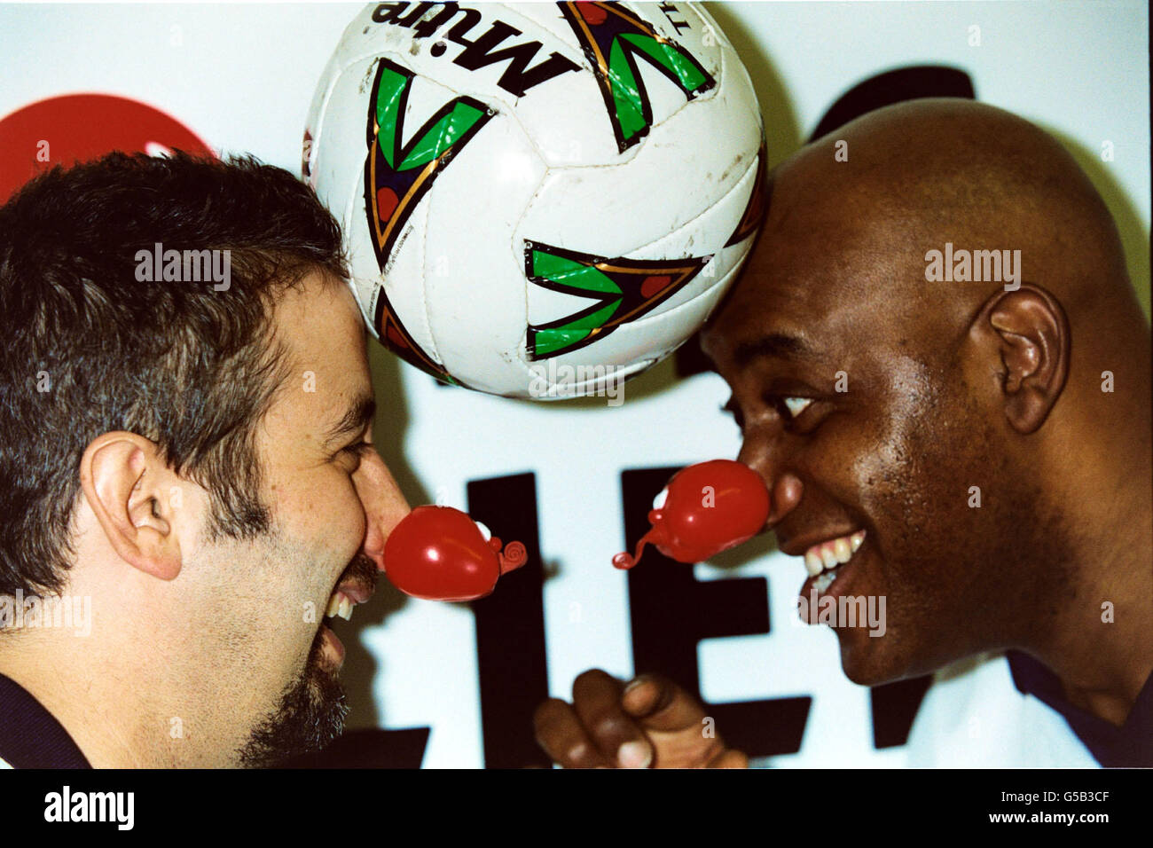 David Baddiel and Ainsley Harriott teamed up for the Sporting Nose celebraties football team. The TV chef and Baddiel were lining up at Olympia in London, during a Comic Relief football day. Stock Photo