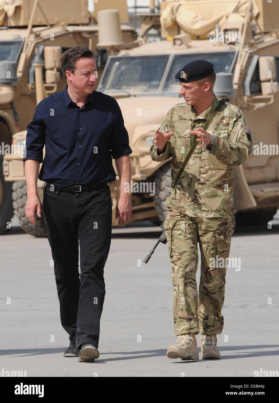 Prime Minister David Cameron is met by Major Toby Stratten Brown at Camp Bastion in Afghanistan, Helmand Province today. Stock Photo