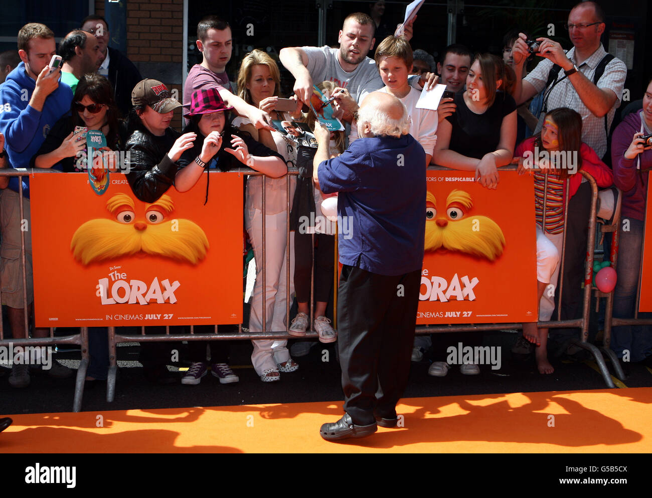 Danny DeVito signs autographs at 'The Lorax' UK film premiere at Cineworld, Birmingham. Stock Photo