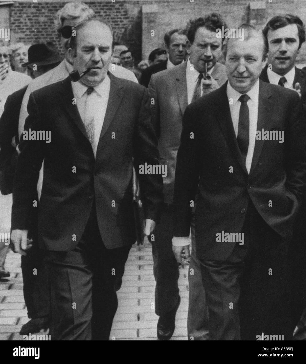 Neil Blaney [left foreground] former Eire Minister for Agriculture who was freed when four other men charged with conspiracy to import arms and ammunition into Southern Ireland illegally were sent for trial from the district court. On the right is Eire Finance Minister Charles Haughey, one of the four sent for trial. Stock Photo