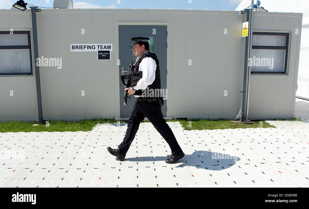An armed police officer is seen inside a police Muster Briefing and Deployment Centre for the