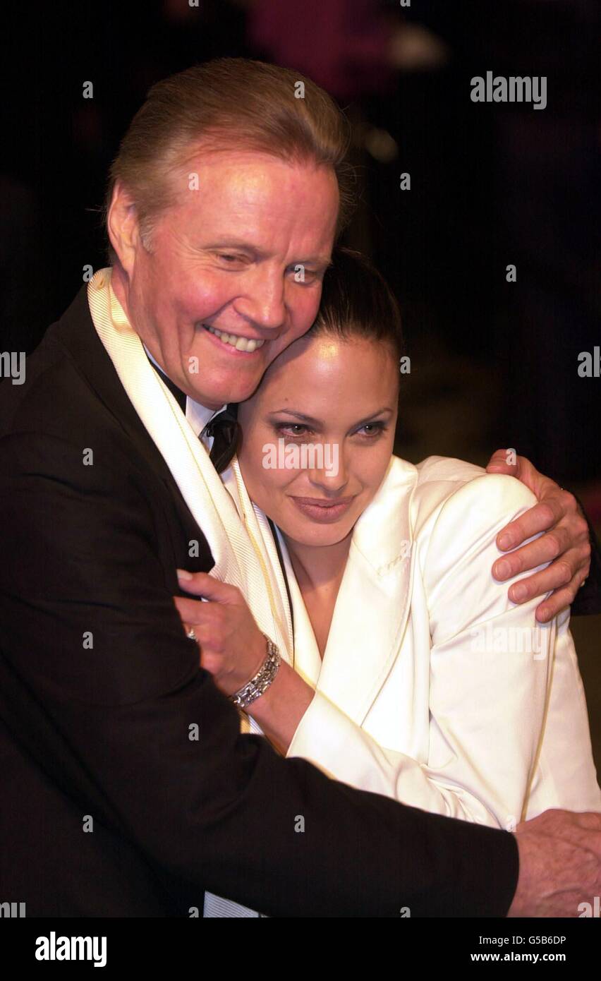 Actor Jon Voight and daughter actress Angelina Jolie at the Vanity Fair Post Oscars Party, held at Morton's in Los Angeles, USA. Angelina is wearing a white tuxedo designed by Dolce and Gabbana. *01/07/01 Angelina Jolie revealed one of the motivating factors behind accepting the role of cyberbabe Lara Croft in the forthcoming blockbuster Tomb Raider was the opportunity to work with her father. Tomb Raider, which is released in the UK later this week, sees the pair recreate their real-life father and daughter roles on screen. 11/8/03: Movie star Angelina Jolie told how she has ditched her Stock Photo