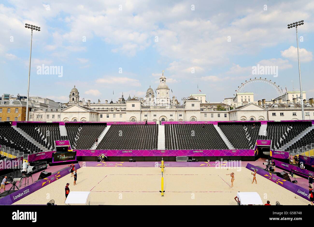 Shauna Mullin (2nd right) and Zara Dampney (right) from Great Britain's Women's Volleyball team during a training session on Centre Court at the Beach Volleyball arena at Horse Guards Parade in central London. Stock Photo