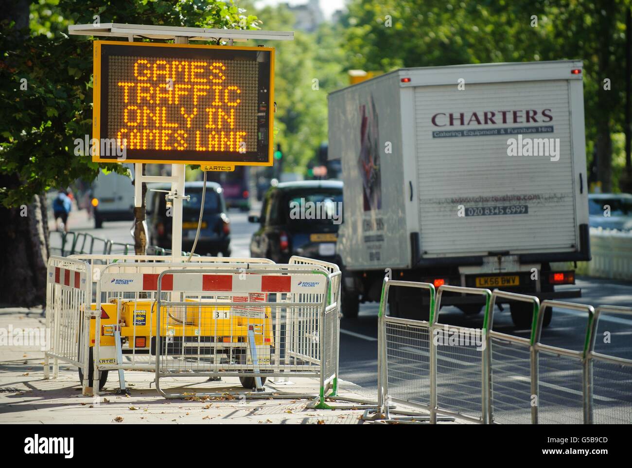 An electronic sign alongside an Olympic traffic lane in central London. Stock Photo