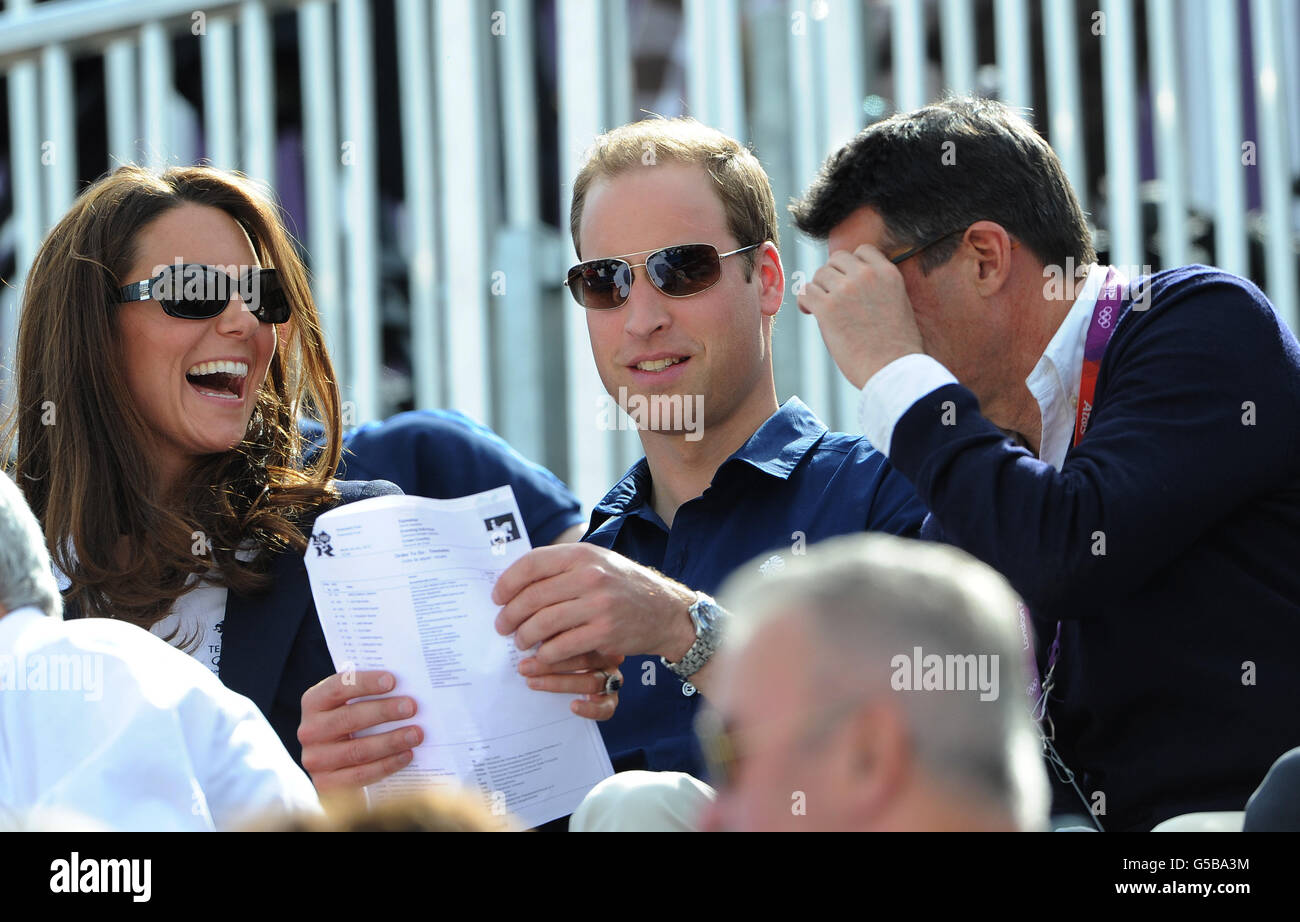 LOCOG Chairman Lord Sebastian Coe (right) with the Duke and Duchess of Cambridge as they watch the Cross Country Phase of The Eventing at Greenwich Park, on the third day of the London 2012 Olympics. Stock Photo