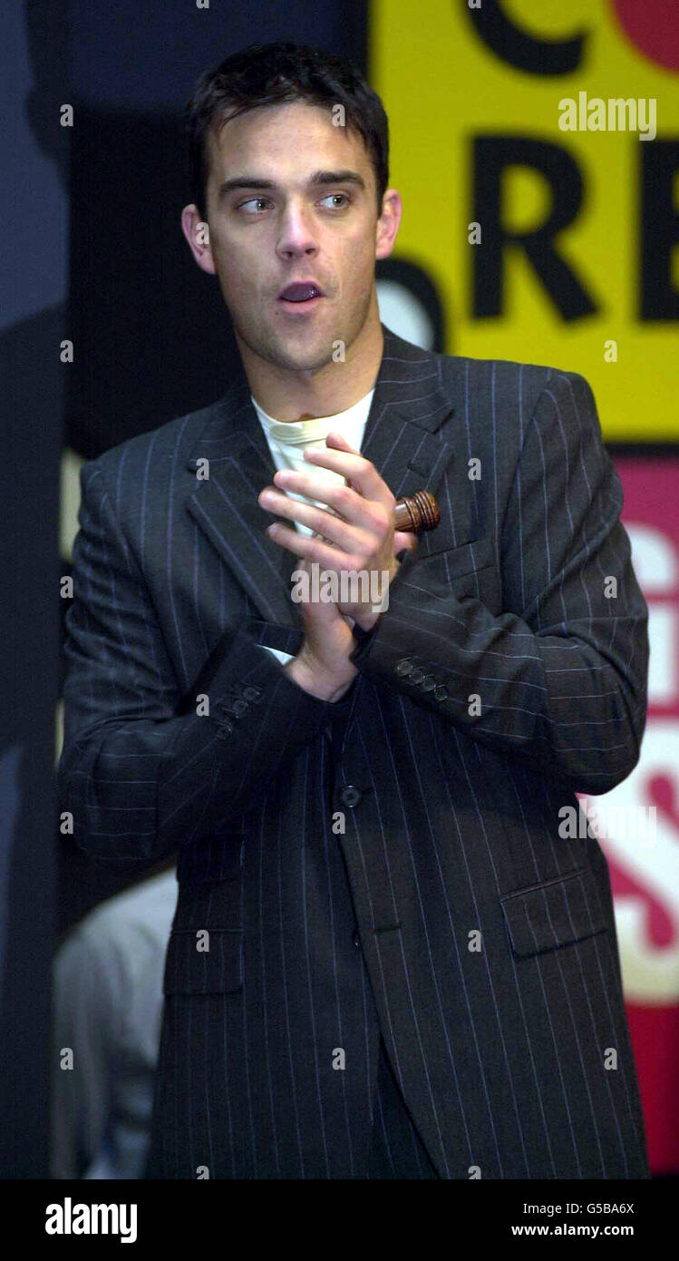 Singer Robbie Williams during an auction for Comic Relief at Sotheby's ...
