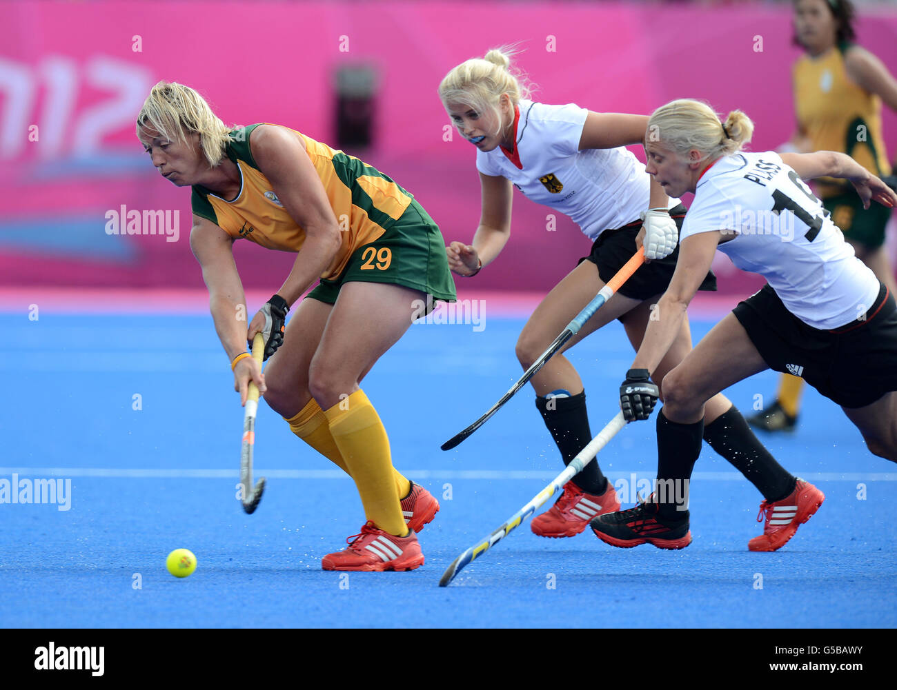 London Olympic Games - Day 6. South Africa's Tarryn Bright and Germany's Jennifer Plass (right) in action in action during their Pool B match at The Riverbank Arena Stock Photo