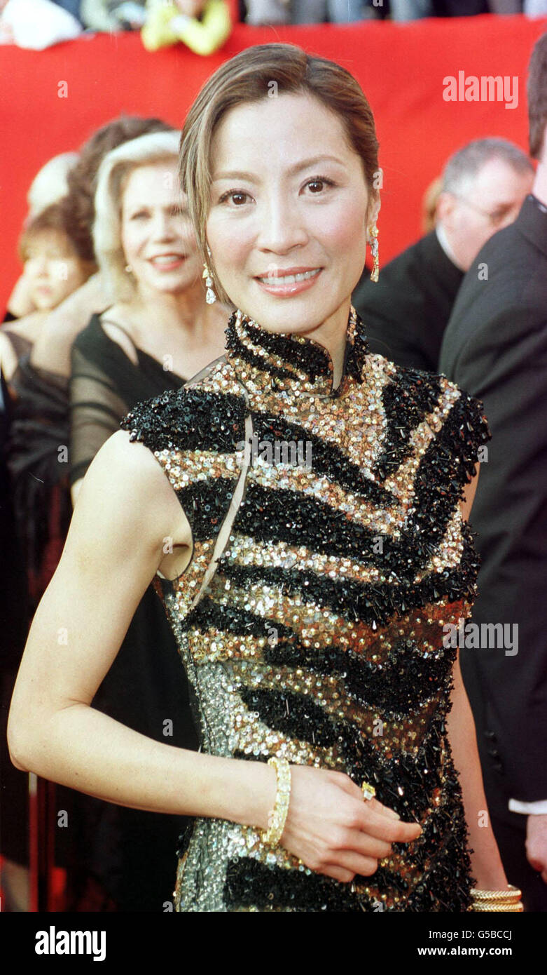 Actress Michelle Yeoh, star of Crouching Tiger Hidden Dragon, at the 73rd Annual Academy Awards, held at the Shrine Auditorium in Los Angeles. She is wearing an ankle length glittering cheongsam by Barney Cheng. Stock Photo