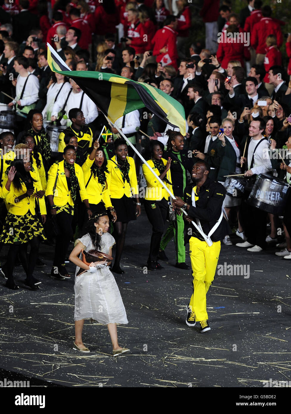 Jamaica's Usain Bolt carries their flag during the Olympic Games 2012 Opening Ceremony at the Olympic Stadium, London. Stock Photo