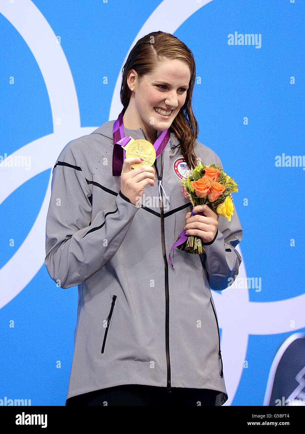 USA's Missy Franklin smiles on the podium with her gold medal after winning in the Women's 100m Backstroke Final at the Aquatics Centre in the Olympic Park, London Stock Photo