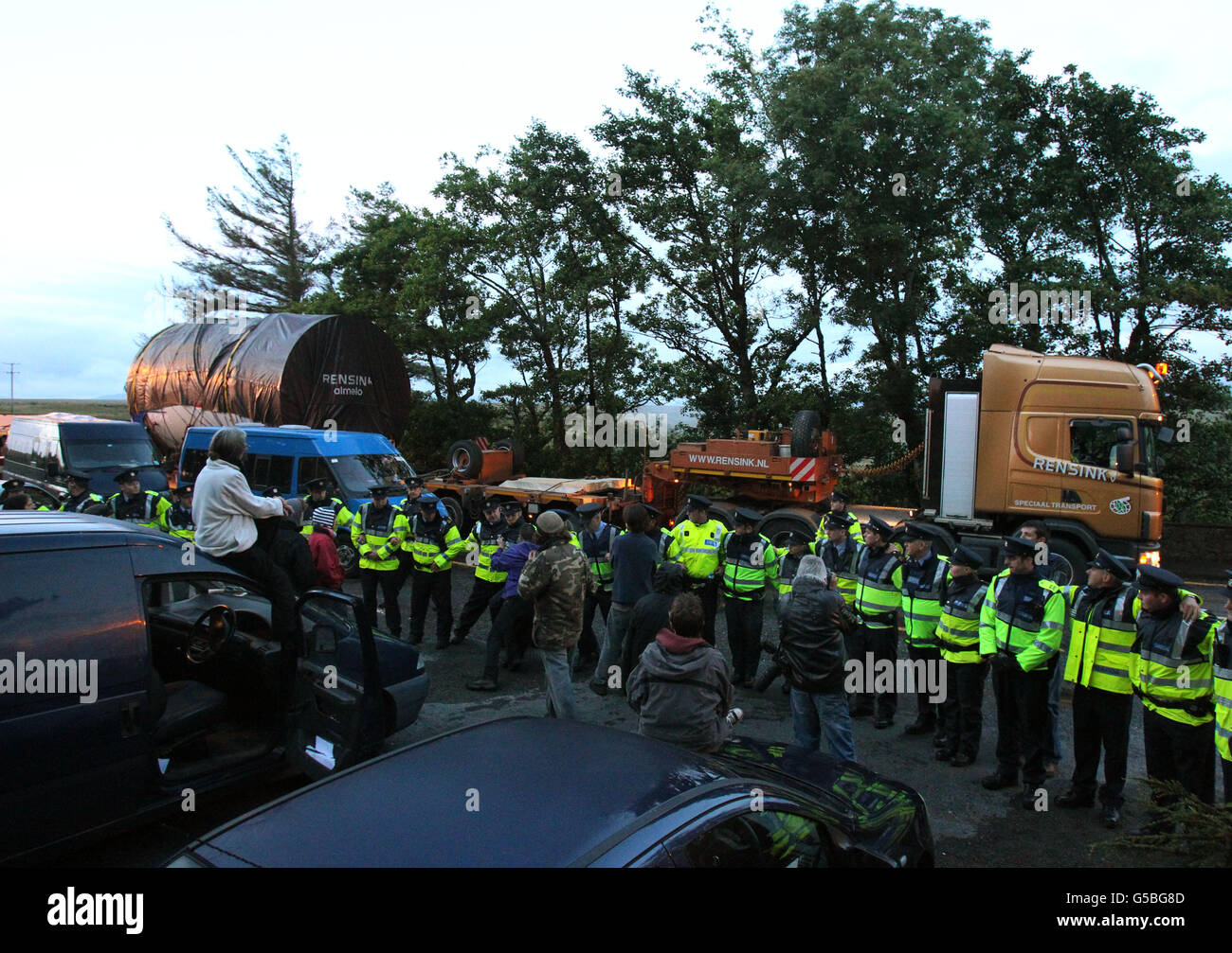 Shell to Sea activists clash with Gardai after they blocked the path of a convoy containing Tunnel Boring Machinery on its way to the Shell Bellanaboy Gas refinery in Co Mayo. Stock Photo