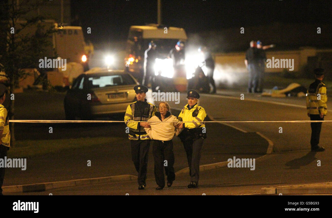 Shell to Sea activist Maura Harrington is detained as Gardai use specialist cutting equipment to remove Shell to Sea activists after they blocked the path of a convoy containing Tunnel Boring Machinery on its way to the Shell Bellanaboy Gas refinery in Co Mayo. Stock Photo