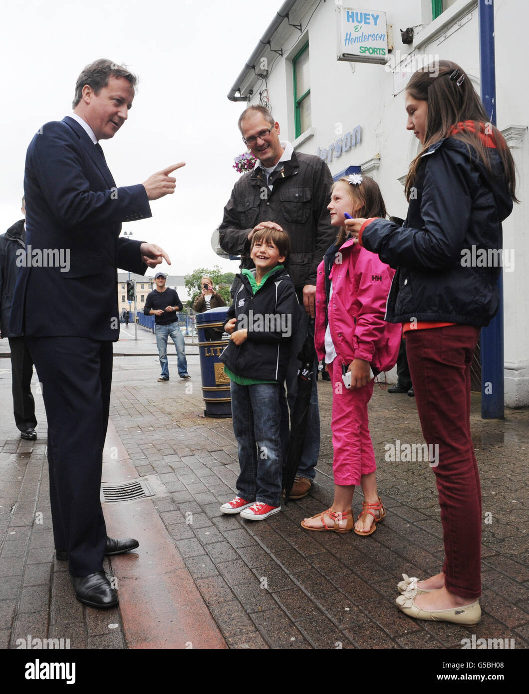 Prime Minister David Cameron meets shoppers in Coleraine High Street in Northern Ireland, during a visit to the region. Stock Photo