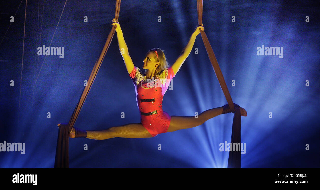 Monalisa performs gymnastics while suspended by silk during a promotion for the Edinburgh International Circus Festival. Stock Photo
