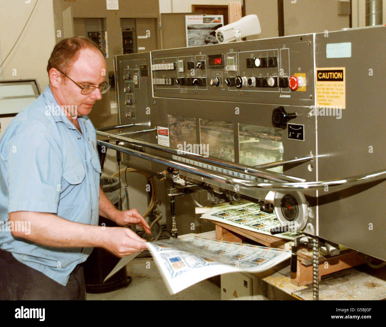 The printing machine prints out the sheets of the approved stamp of the Queen before its record breaking journey from the House of Questa to be first sold in Gibraltar. An attempt will be made to produce the stamp in a record breaking 11 hours. * It is in honour of the Queen's 75th birthday. Stock Photo