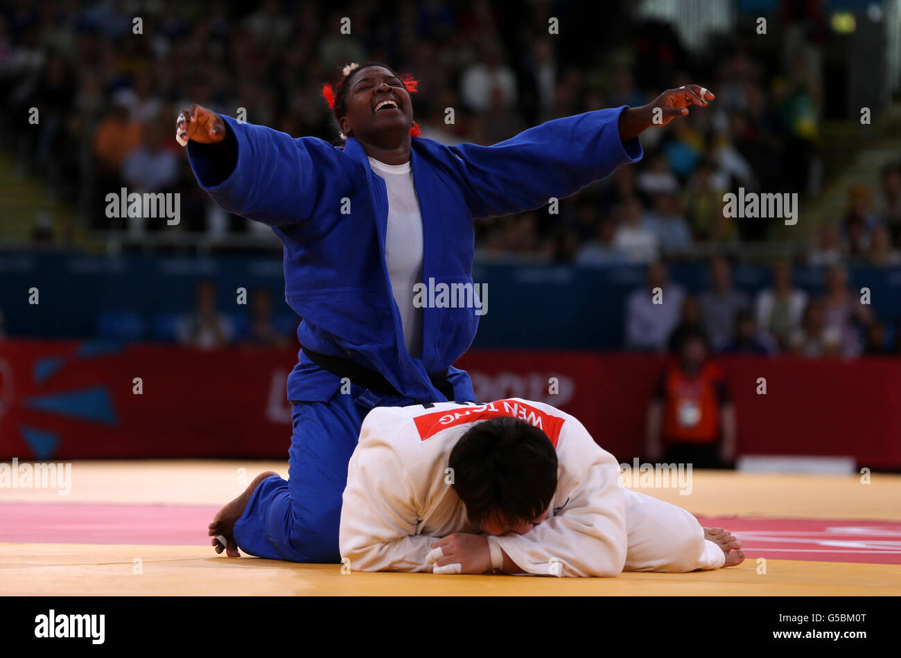 Cuba's judo player Idalys Ortiz celebrates victory in semi over China's