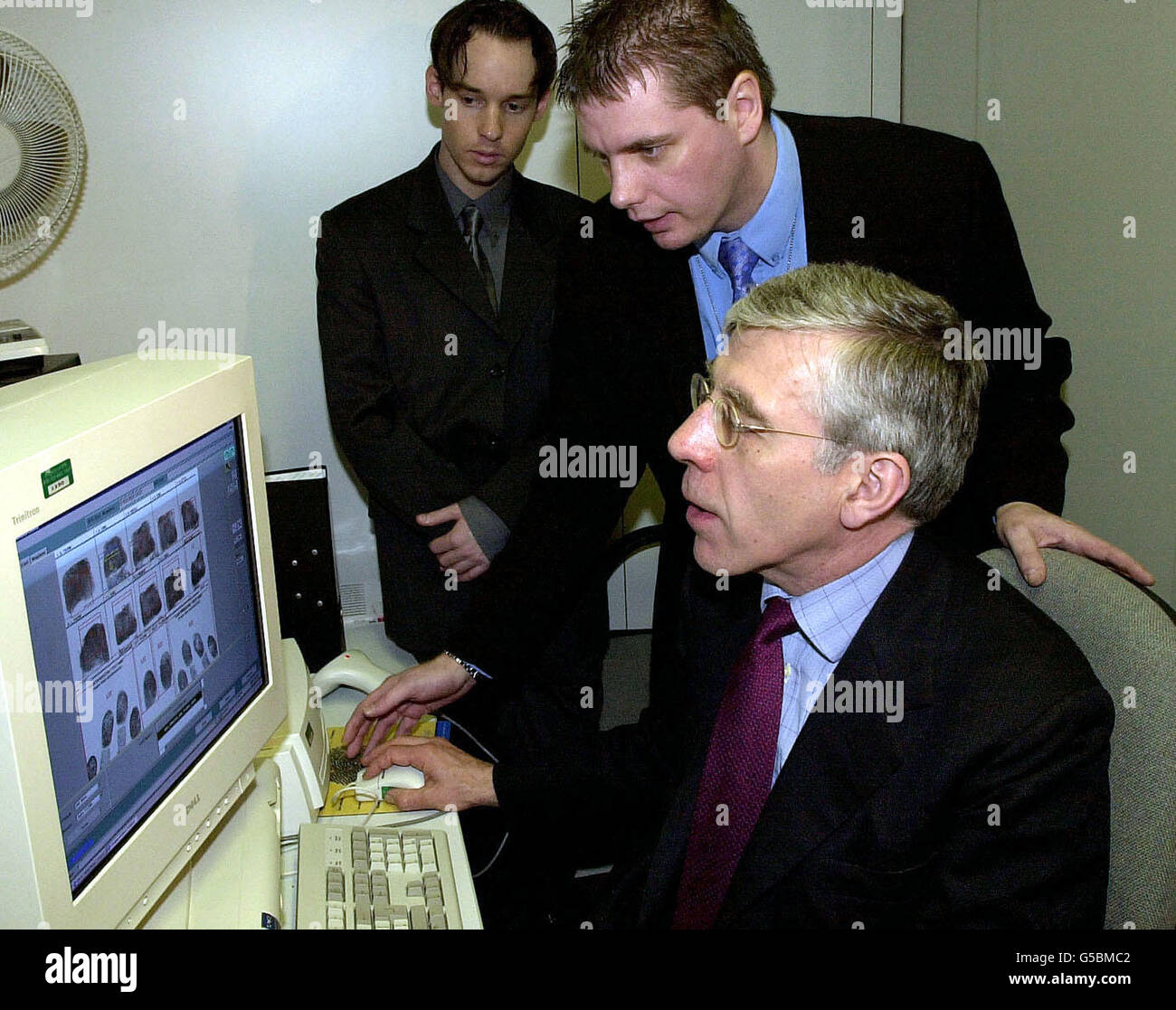 Britain's Home Secretary Jack Straw is given a demonstration of new