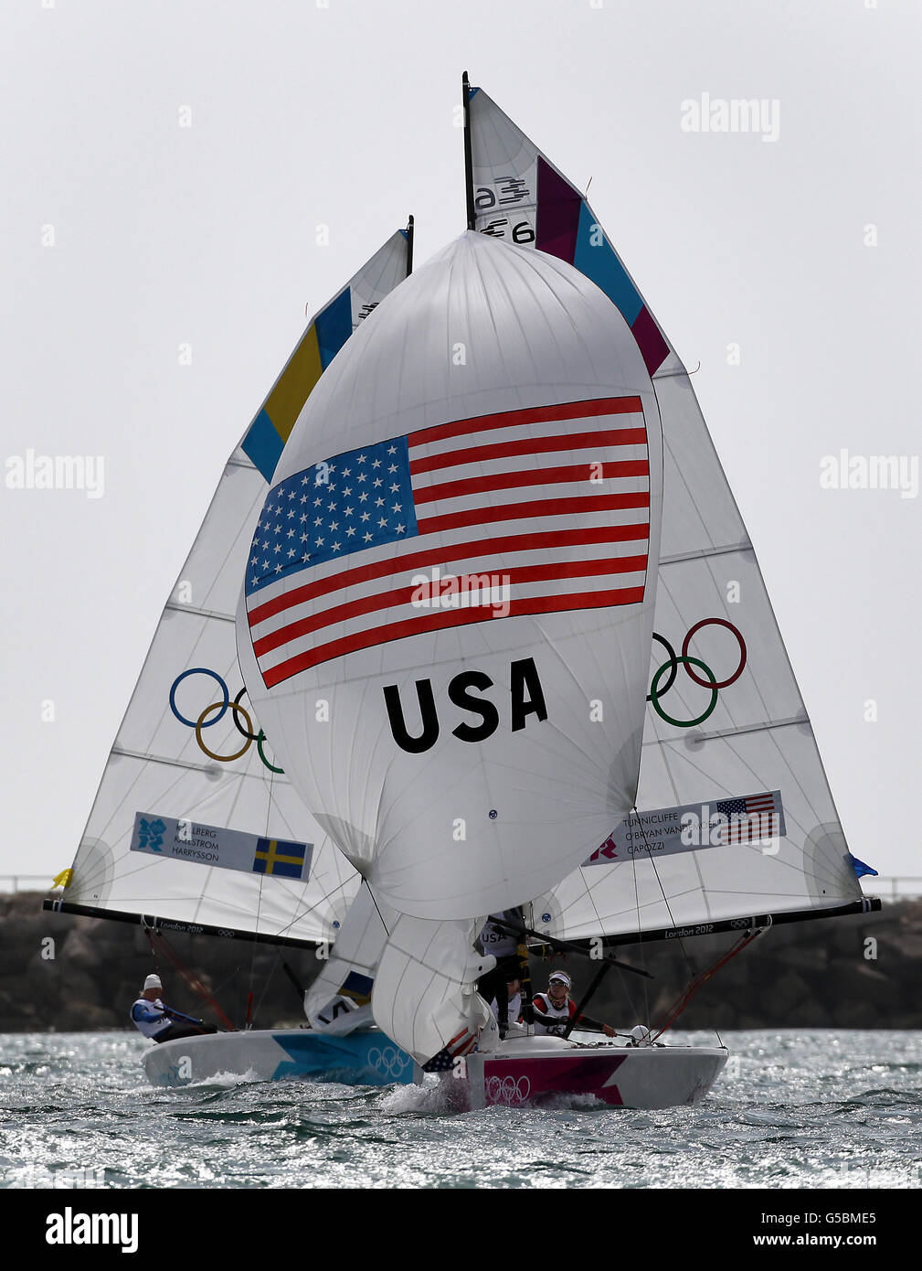 Sweden and USA Match race team joust for position on the run to the leeward mark during the fifty ninth race of the Olympic Elliott match race series off Weymouth. Stock Photo