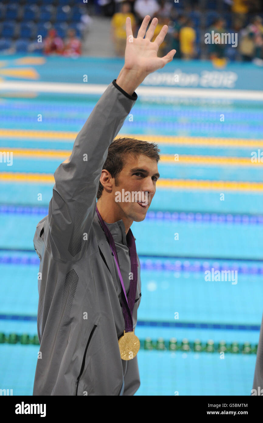 USA's Michael Phelps celebrates with his 22nd Olympic Medal and his