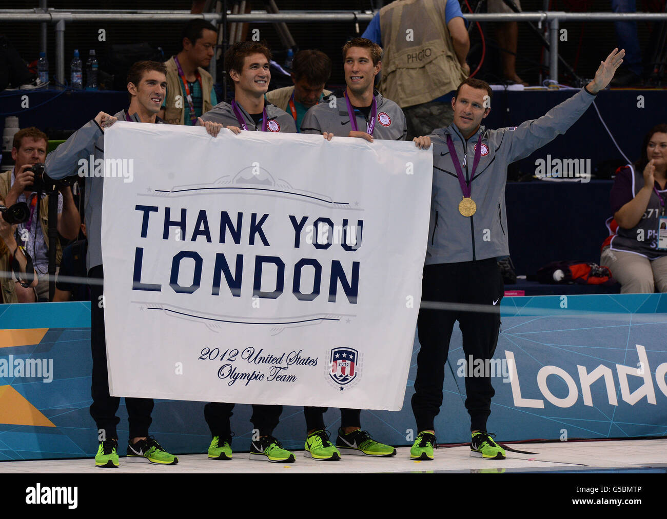 The USA's Men's 4x100m Medley relay team hold up a message thanking