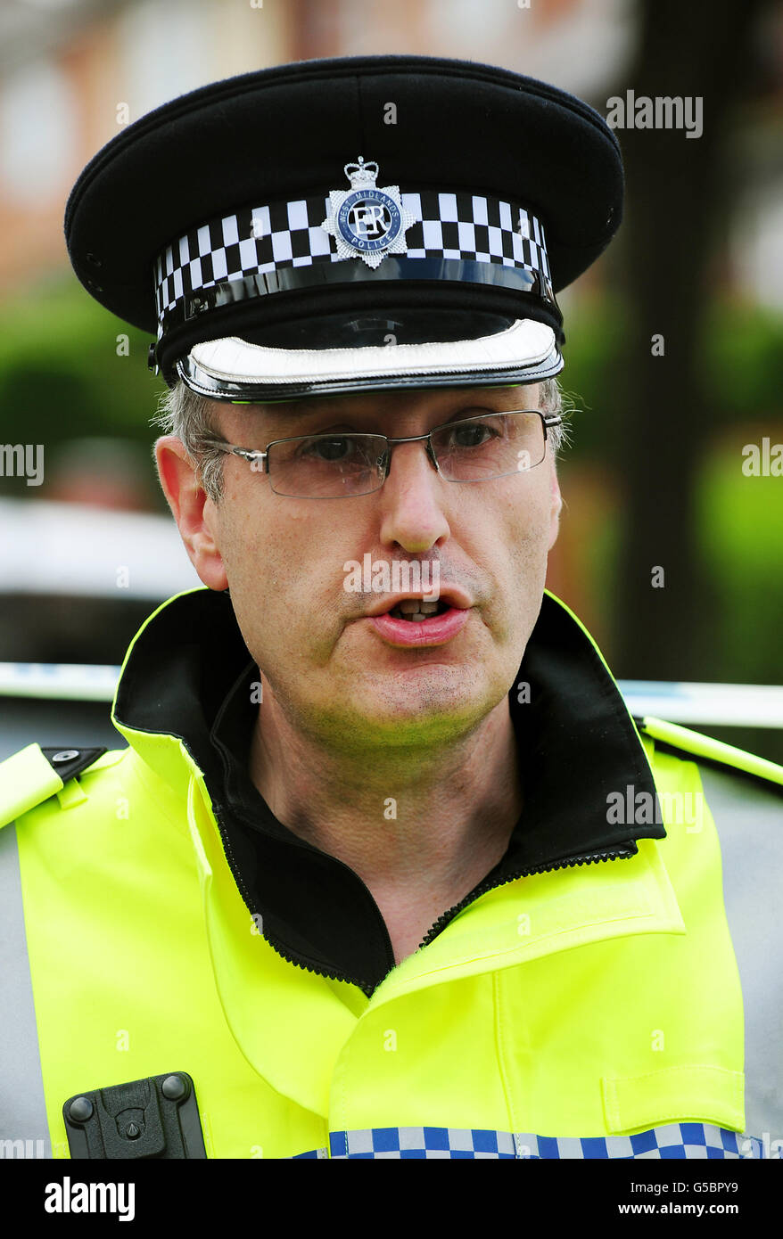 West Midlands Police Superintendent Andy Shipman talk to the media at the scene in Birmingham, where a woman was stabbed to death in a taxi today. Stock Photo