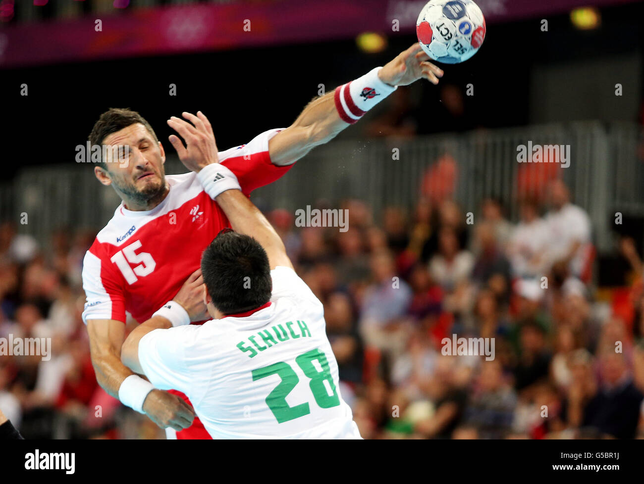 Iceland's Alexander Petersson gets his shot away in the Quarter Final match with Hungary during the Handball Men's Quarterfinal match at the Basketball Arena, Olympic Park, London. Stock Photo