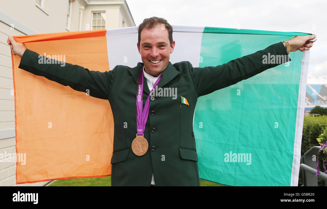 Ireland's Cian O'Connor celebrates with his bronze medal after the Individual Jumping Final B at Greenwich Park, on the twelfth day of the London 2012 Olympics. Stock Photo