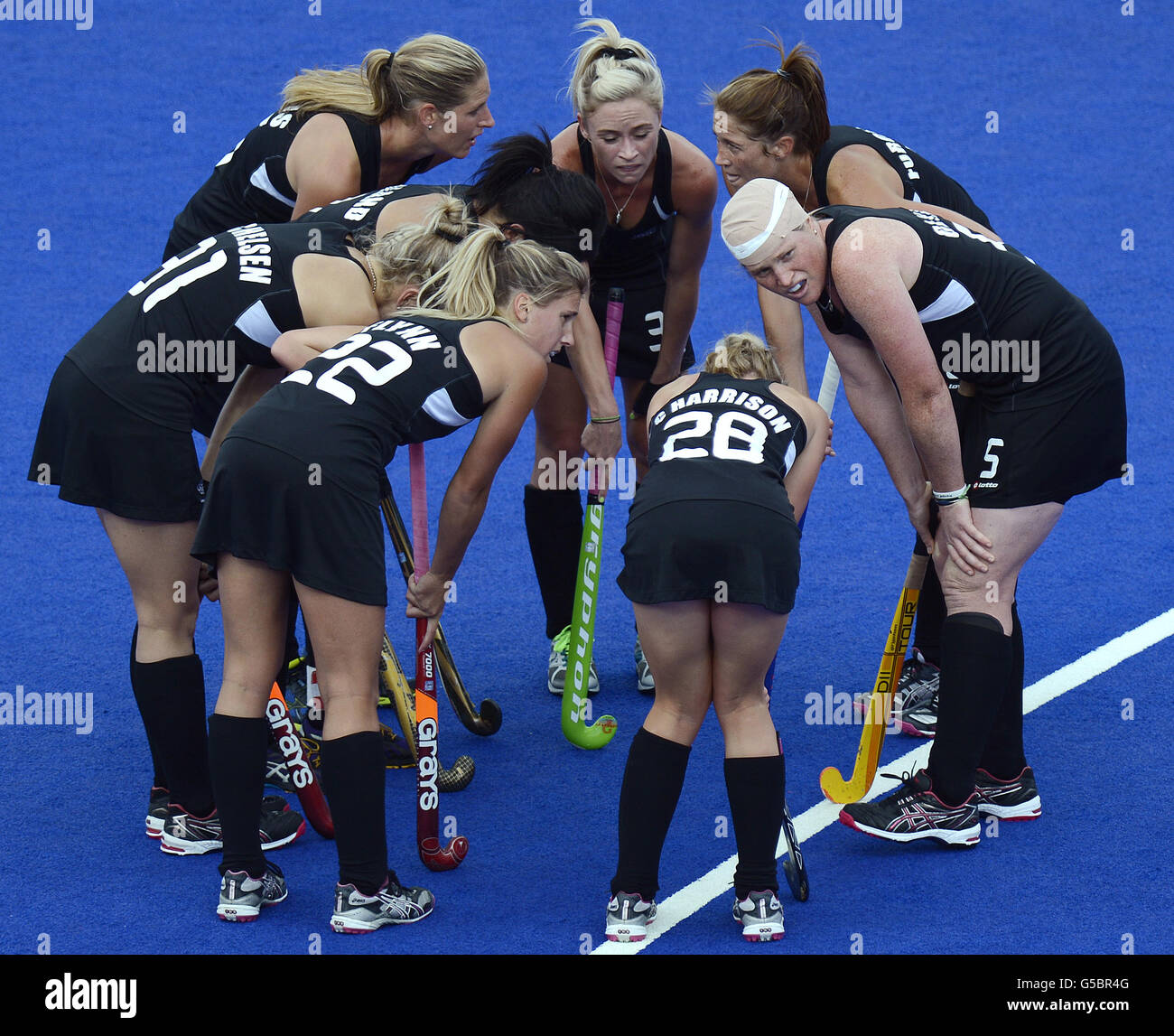 New Zealand's Katie Glynn (right) returns to the field with her head bandaged, during the Women's Semi-final at the Riverbank Arena during Day 12 of the London 2012 Olympics. Stock Photo