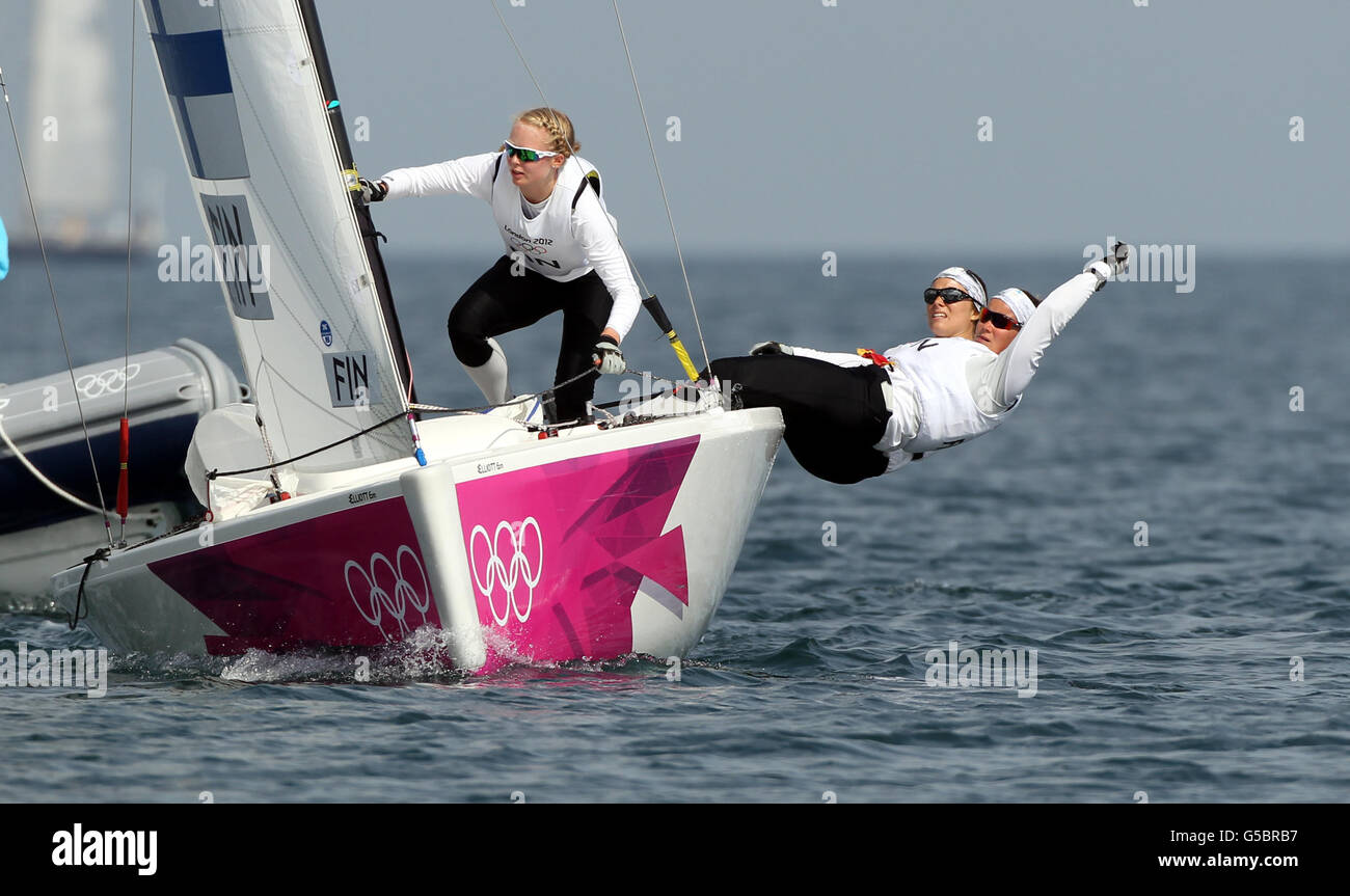 Finland's matchracing crew Silja Lehtinen, Silja Kanerva and Mikaela Wulff during their Olympic quarter final match against USA on the waters off Weymouth today. Stock Photo