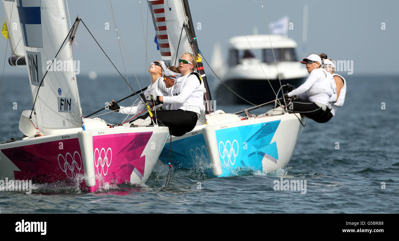 Finland's Silja Lehtinen, Silja Kanerva and Mikaela Wulff during their Olympic quarter final match against USA on the waters off Weymouth today. Stock Photo
