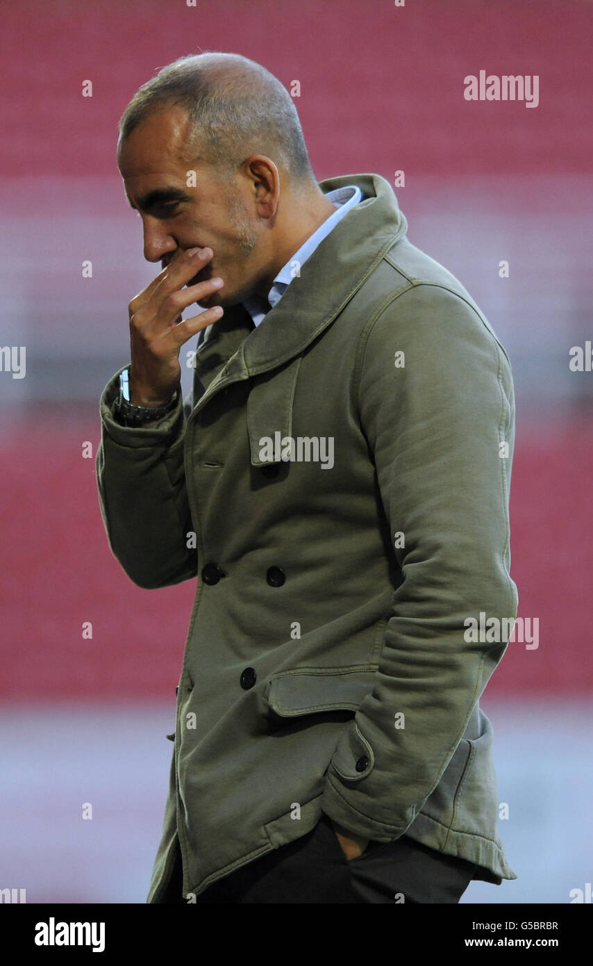 Soccer - Pre Season Friendly - Swindon Town v Crystal Palace - The County Ground. Swindon Town manager Paolo Di Canio looks ponderous Stock Photo