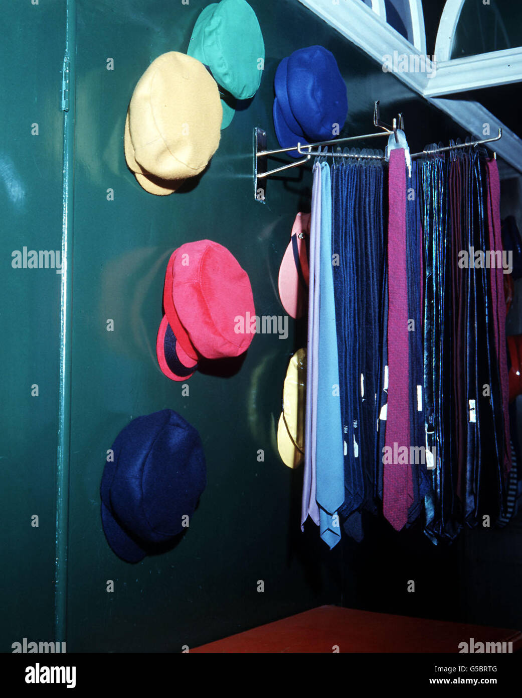 London is 'With It'. A selection of colourful hats and ties on display at the John Stephens boutique in Carnaby Street. Stock Photo
