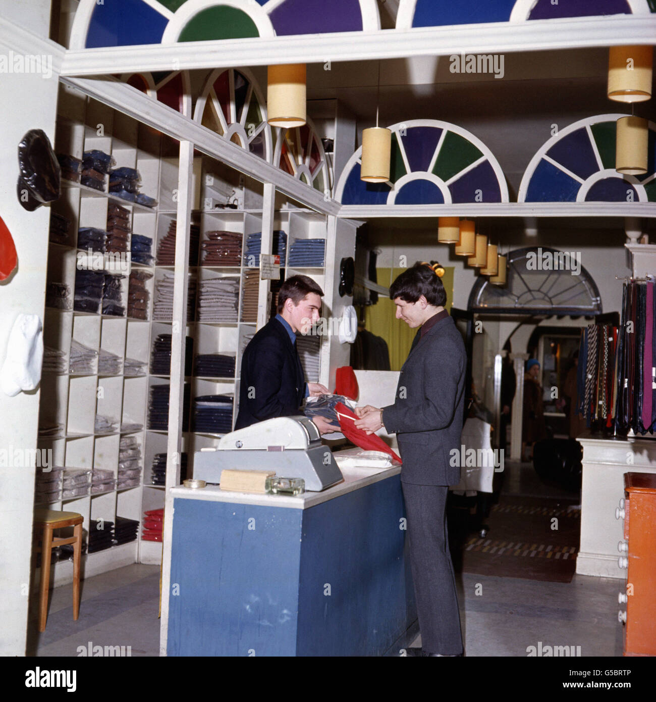 A customer in the John Stephens boutique, one of the many 'With It' shops in London's Carnaby Street, the hub of the 'Swinging Sixties' in London. Stock Photo