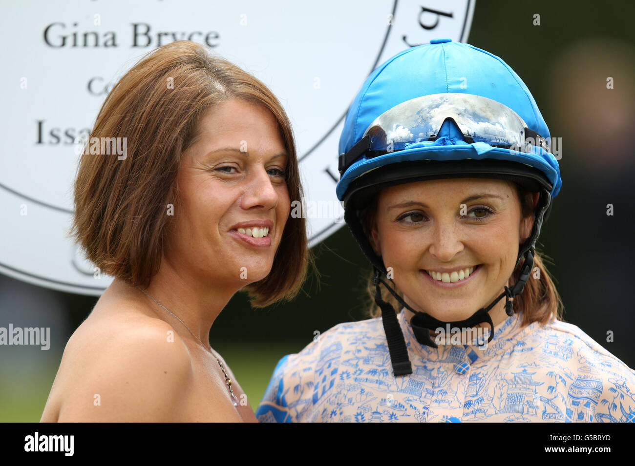 Horseracing presenter Gina Bryce (right) during Ladies Day of the Glorious Goodwood Festival at Goodwood Racecourse, Chichester. Stock Photo