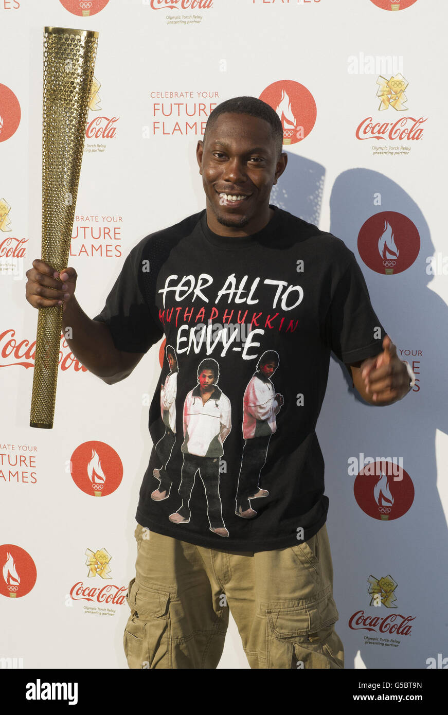 Dizzee Rascal 2012 Dizzee Rascal holding an Olympic Torch backstage at the Coca Cola ...