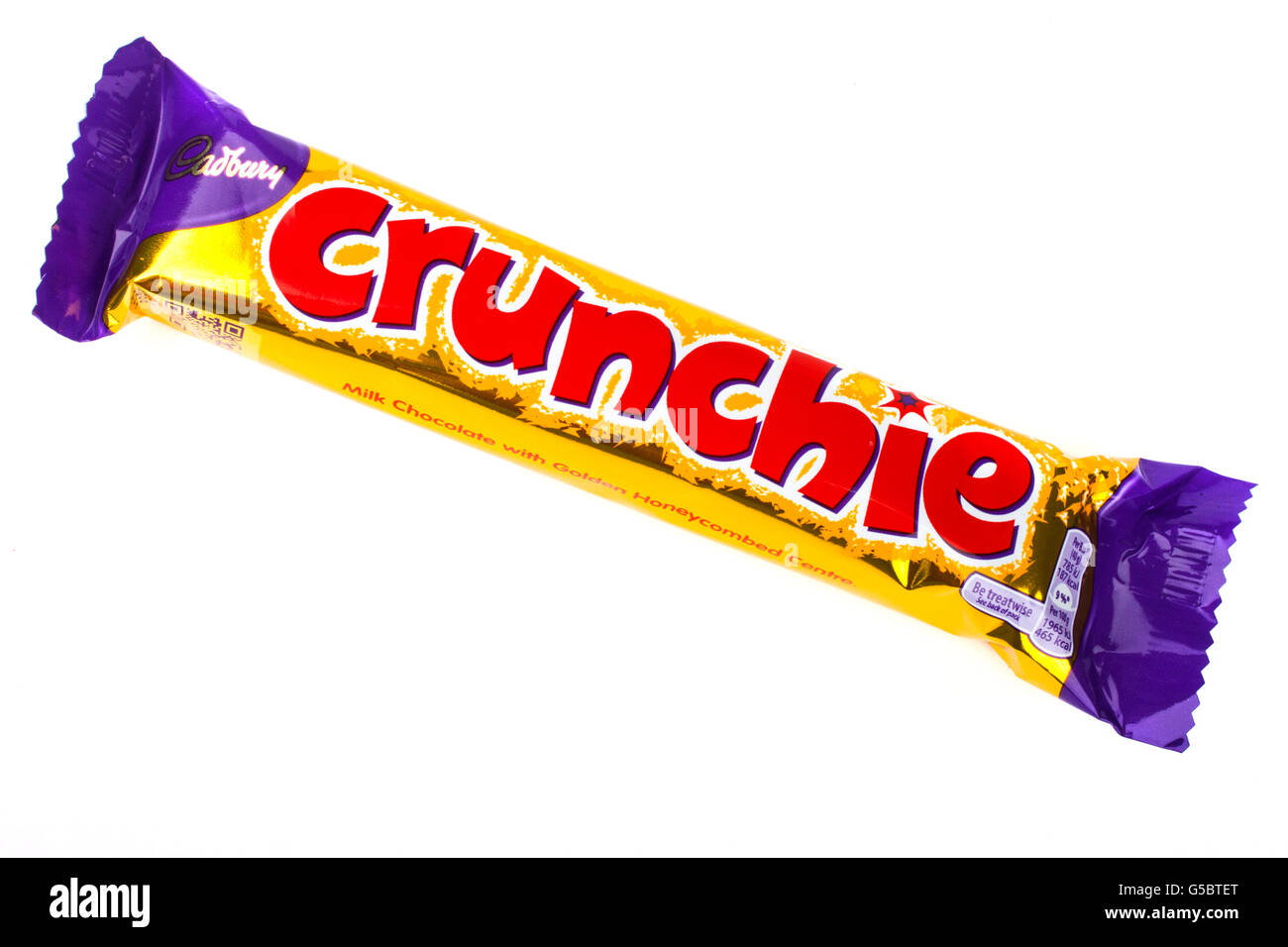 LONDON, UK - JUNE 16TH 2016: An unopened Crunchie chocolate bar manufactured by Cadbury, pictured over a plain white background Stock Photo