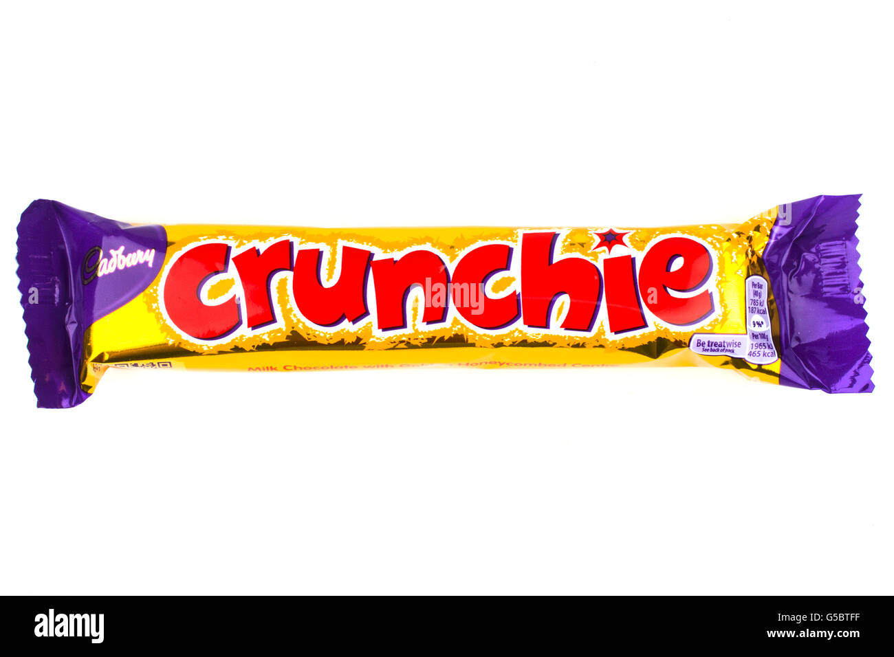 LONDON, UK - JUNE 16TH 2016: An unopened Crunchie chocolate bar manufactured by Cadbury, pictured over a plain white background Stock Photo