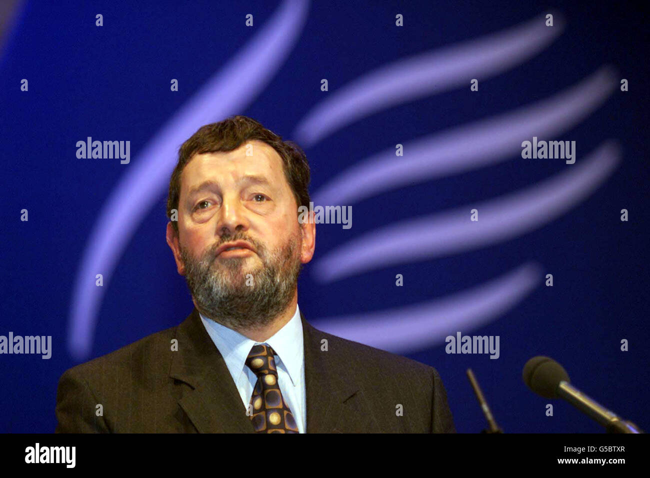 Education Minister David Blunkett speaking at the National Union of Teachers (NUT) annual conference in Cardiff. Fresh evidence of the deep divisions within the union over its decision to suspend industrial action over teacher shortages emerged * ... when its president said he voted against the move. John Illingworth, who opened the conference with a speech that got a standing ovation from delegates, was one of 19 members of the national executive who opposed the decision. Stock Photo