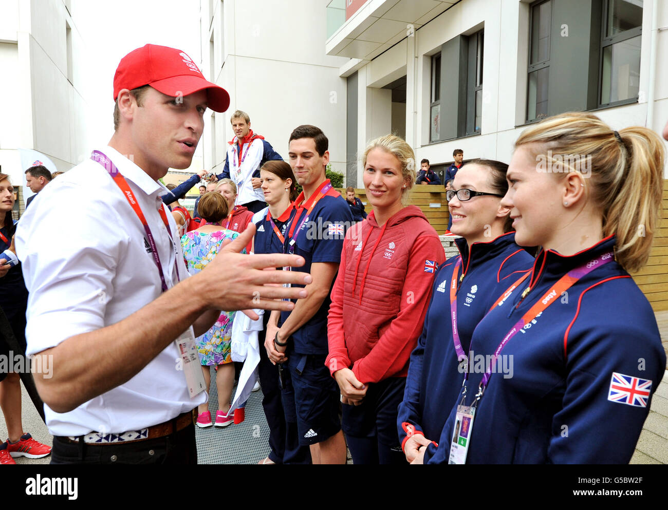 The Duke of Cambridge talks with Great Britain cyclist Victoria Pendleton (second right) during a visit to the Team GB accommodation flats in the Athletes Village at the Olympic Park in Stratford, east London. Stock Photo
