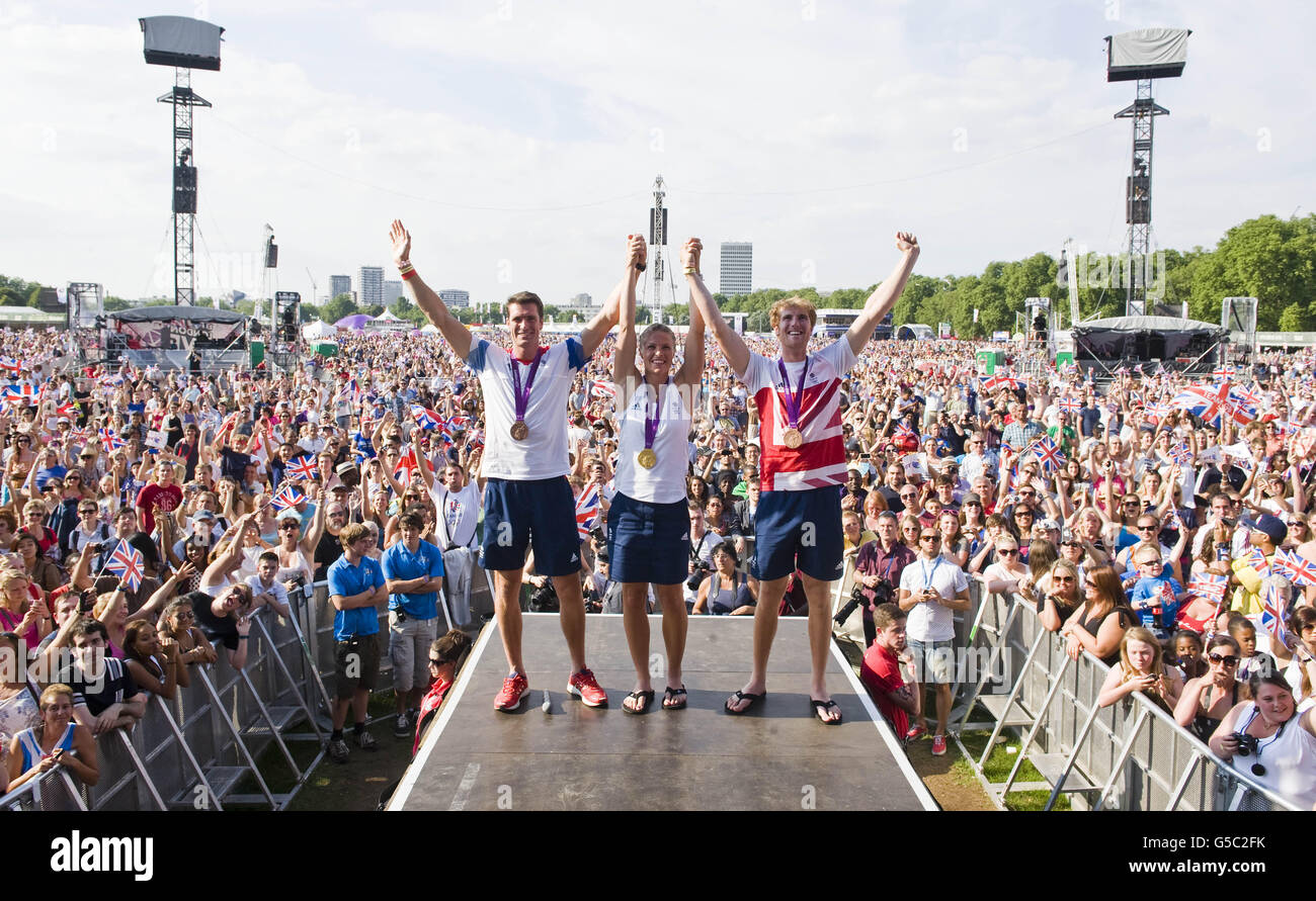 Great Britain's Anna Watkins with her Gold medal she won in the women's double sculls and Bronze medal rowers, (left to right) Greg Searle and George Nash, at BT London Live, in Hyde Park, central London. Stock Photo