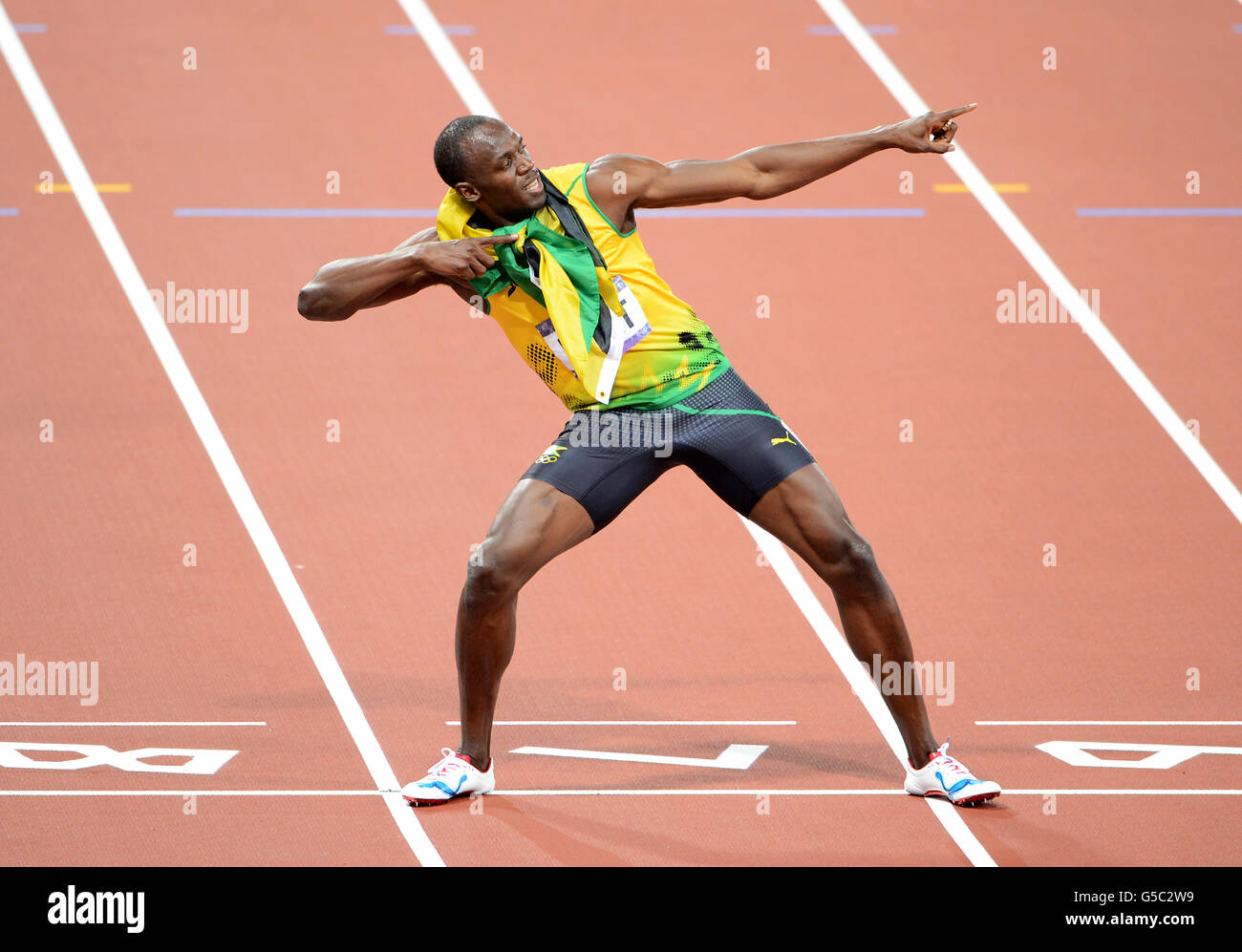 Jamaica's Usain Bolt celebrates winning the Men's 200m Final on day