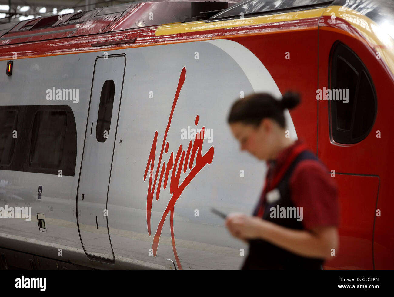 A Virgin train at Central Station in Glasgow, Scotland, as Virgin Rail lost its West Coast main line franchise, with transport company FirstGroup taking over from December, the Government announced today. Stock Photo