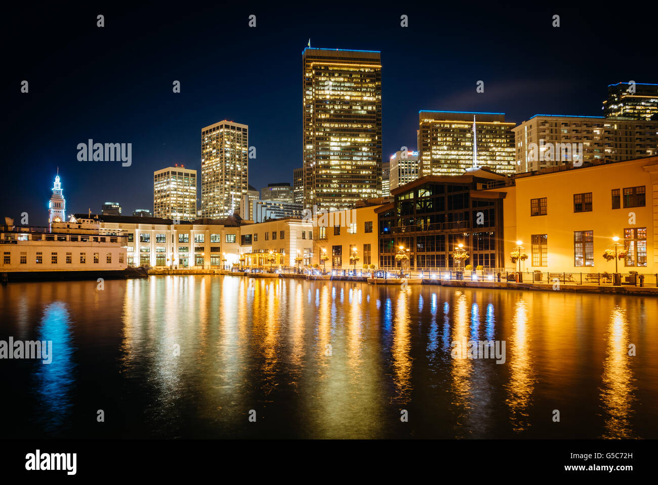 Modern skyscrapers at night, seen from Pier 7, in San Francisco, California. Stock Photo