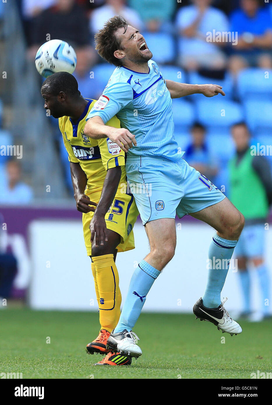 Coventry City's Kevin Lilbane and Bury's Lateef Elford - Alliyu in action during the npower Football League One match at the Ricoh Arena, Coventry. Stock Photo
