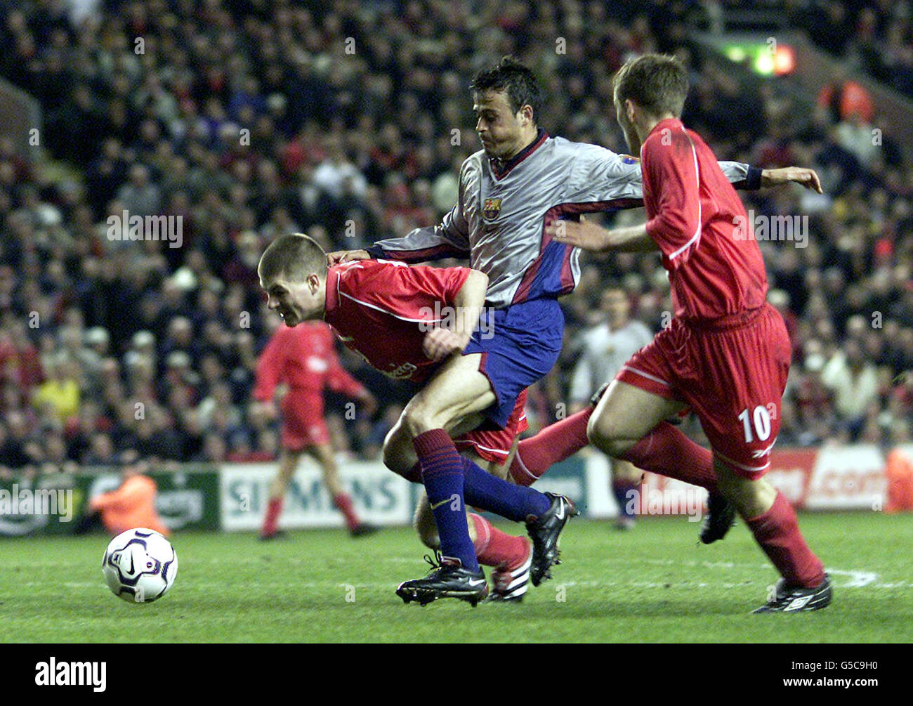 Liverpool's Steven Gerrard (left) goes down under a challenge from Barcelona's Luis Enrique, but fails to be awarded a penalty, during their UEFA Cup semi-final second leg football match at Anfield, in Liverpool. Stock Photo
