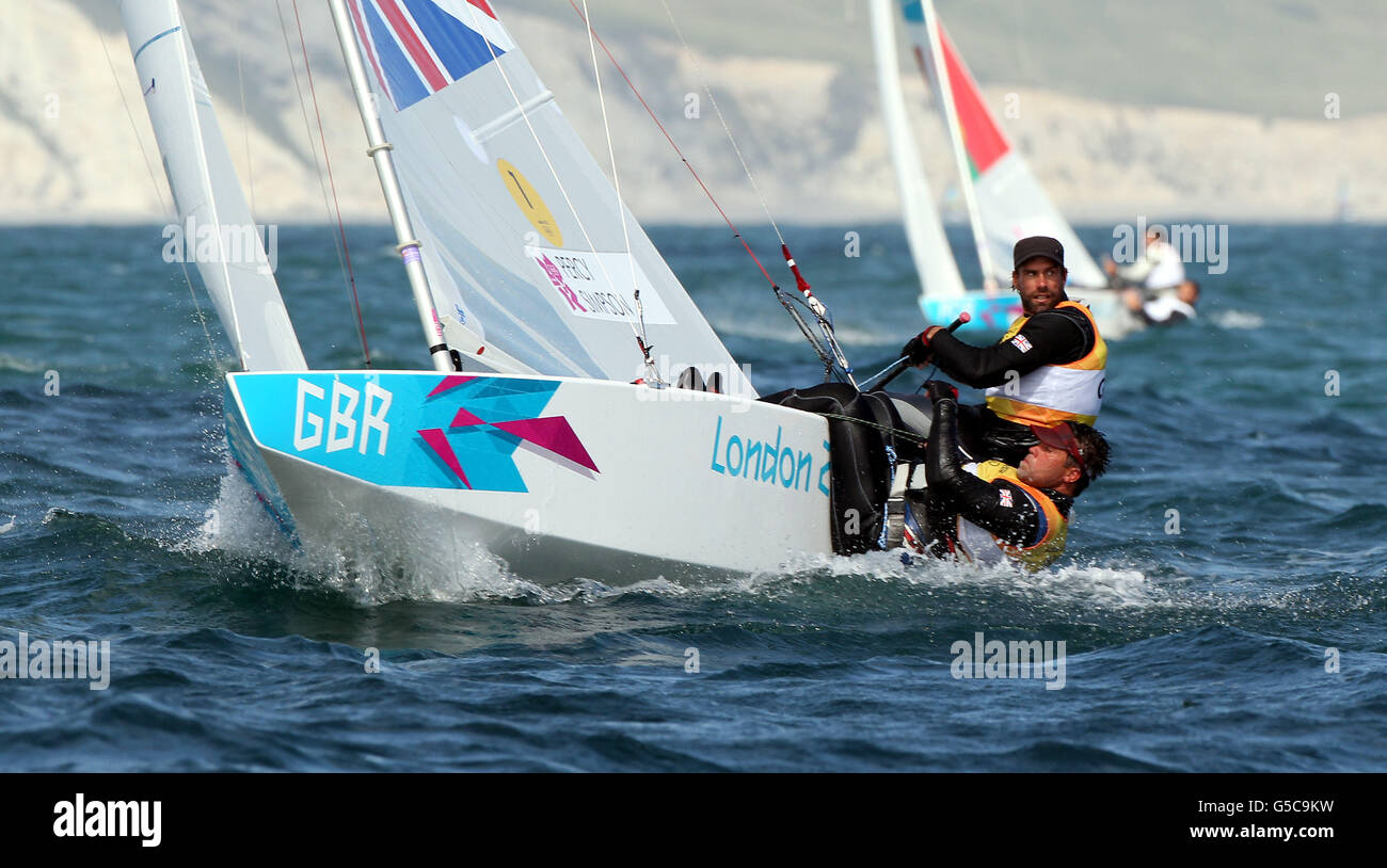 Great Britain's Star sailors Iain Percy and Andrew Simpson during the tenth race of their Olympic series in Weymouth Bay today. The team currently lead the sixteen boat fleet. Stock Photo