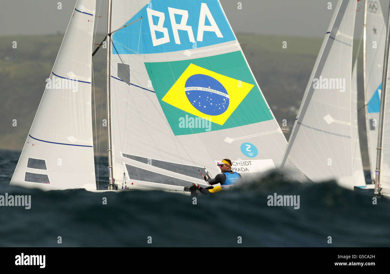 Brazil's Robert Scheidt and Bruno Prada racing in the Star class on Weymouth Bay today during the Olympics. They are trailing Great Britain's Iain Percy and Andrew Simpson by eight points as they head into Sunday's Medal Race. Stock Photo