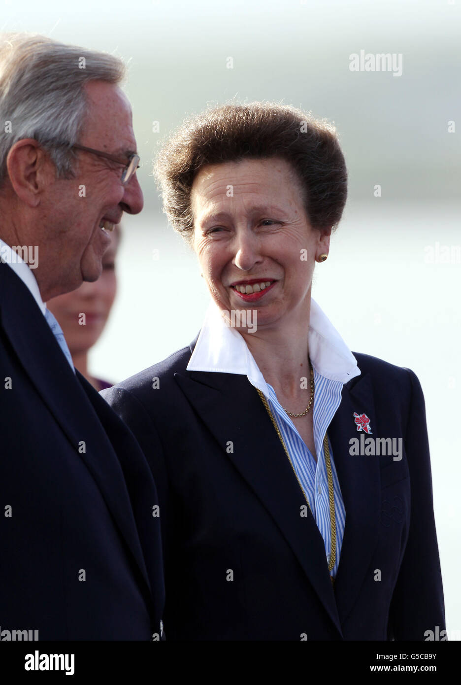 The Princess Royal talks with King Constantine during this evening's medal ceremony for the Finn class during the Olympic regatta in Weymouth. Stock Photo